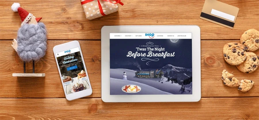 'Twas the Night Before Breakfast page on a tablet and phone among holiday cookies